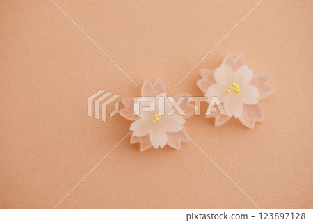 Dried confectionery in the shape of a cherry blossom Dried confectionery in the shape of a cherry blossom 123897128