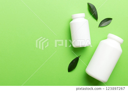 supplement pills with medicine bottle health care and medical top view. Vitamin tablets. Top view mockup bottle for pills and vitamins with green leaves, natural organic bio supplement, copy space supplement pills with medicine bottle health care and medical top view. Vitamin tablets. Top view mockup bottle for pills and vitamins with green leaves, natural organic bio supplement, copy space 123897267