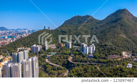 Feb 9 2025 Cityscape with Mountains and Towering Residential Buildings 123897467