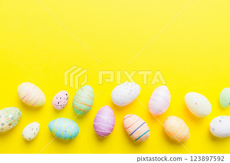 decorative easter eggs on colored background. easter eggs collection top view with copy space 123897592