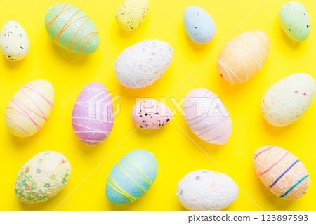 decorative easter eggs on colored background. easter eggs collection top view with copy space 123897593