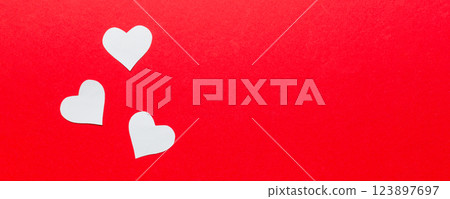 Valentine day background with red hearts, top view with copy space Valentine day background with red hearts, top view with copy space 123897697