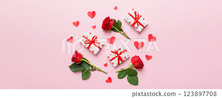 Kraft Gift box with beautiful red ribbon and rose, concept of Valentine day, anniversary, mother day and birthday greeting, copy space, top view Kraft Gift box with beautiful red ribbon and rose, concept of Valentine day, anniversary, mother day and birthday greeting, copy space, top view 123897708