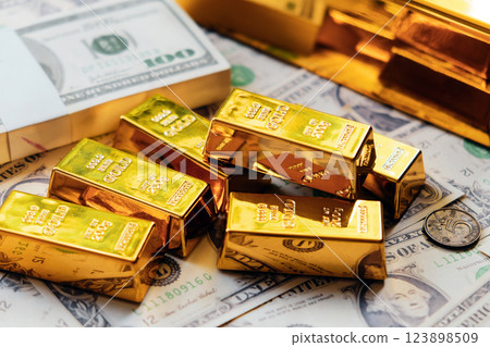 Gold bars and dollar banknotes. Business and finance investment concept. Gold bars and dollar banknotes. Business and finance investment concept. 123898509