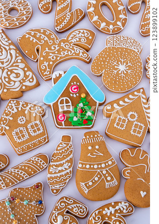 Gingerbread decorated with white sugar glaze. Food background. Christmas cookies. Gingerbread decorated with white sugar glaze. Food background. Christmas cookies. 123899102