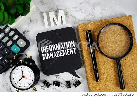 IMIM- Information Management acronym with calculator, alarm clock and magnifying glass, Business concept background IMIM- Information Management acronym with calculator, alarm clock and magnifying glass, Business concept background 123899120