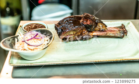 A top sirloin steak flame broiled on a barbecue shallow depth of field. A top sirloin steak flame broiled on a barbecue shallow depth of field. 123899275