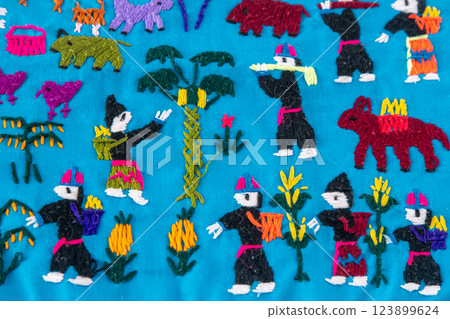 Traditional Embroidery with Village Scenes 123899624