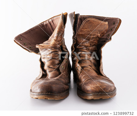 Old shoes on a white background. Leather brown shoe. Worn shoes. 123899732