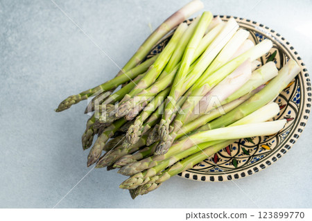Asparagus sprouts on plate. Vegetable food. Asparagus sprouts on plate. Vegetable food. 123899770