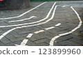Playground pavement with painted road lines and arrows for children play 123899960