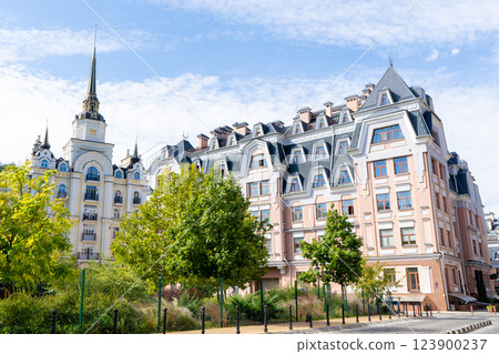 Multicolor modern exterior of houses buildings. Green garden in city Multicolor modern exterior of houses buildings. Green garden in city 123900237