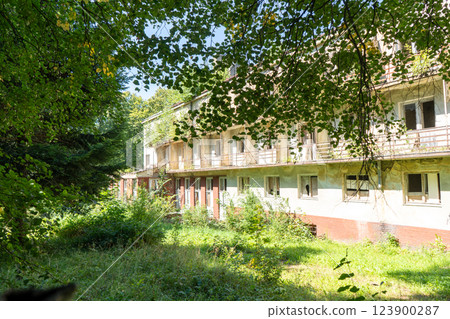 Abandoned old building of the 19th century sanatorium. House with broken windows and balconies. Ukraine, Truskavets 123900287