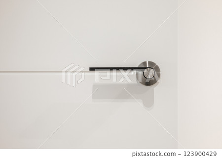 Close-up of a white shelving unit with integrated electrical sockets Close-up of a white shelving unit with integrated electrical sockets 123900429