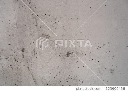 Abstract close-up of raw concrete wall with rough imperfections and surface details 123900436