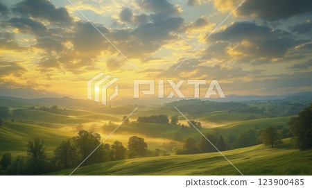 Golden sunrise over rolling hills and mist in a scenic landscape view 123900485
