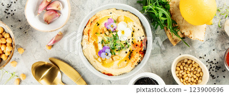 Gourmet Hummus with Edible Flowers, Pine Nuts, and Spices, Banner Image Gourmet Hummus with Edible Flowers, Pine Nuts, and Spices, Banner Image 123900696