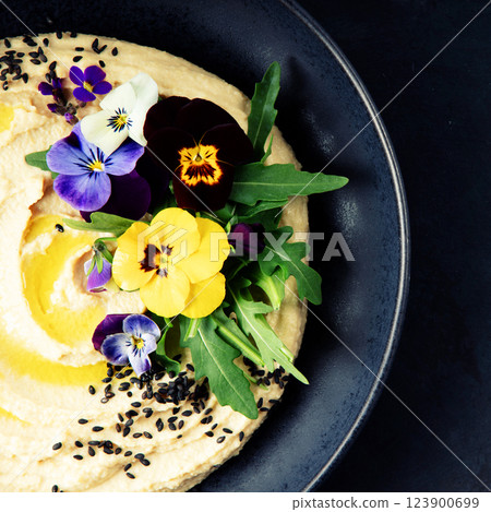 Gourmet Hummus with Edible Flowers and Black Sesame Seeds 123900699
