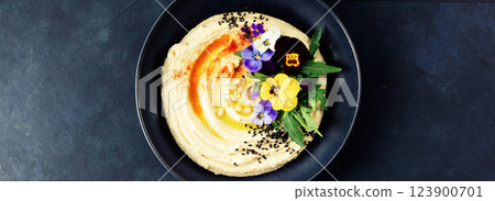 Gourmet Hummus with Edible Flowers, Pine Nuts, and Olive Oil, Banner Image Gourmet Hummus with Edible Flowers, Pine Nuts, and Olive Oil, Banner Image 123900701