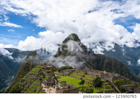 Panoramic view of Machu Picchu ruins surrounded by misty mountains, Peru Panoramic view of Machu Picchu ruins surrounded by misty mountains, Peru 123900765