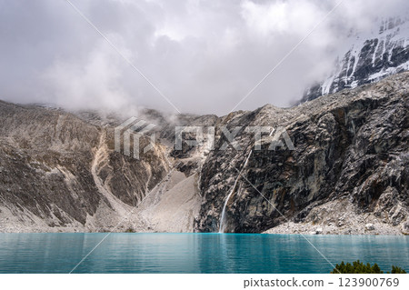 Laguna 69 with turquoise water and snowy mountains in Huaraz, Peru Laguna 69 with turquoise water and snowy mountains in Huaraz, Peru 123900769