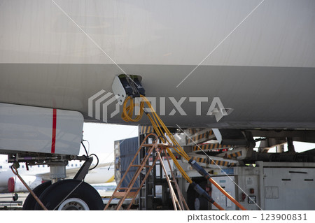 Refueling the plane at the airport. Close-up, place for text 123900831