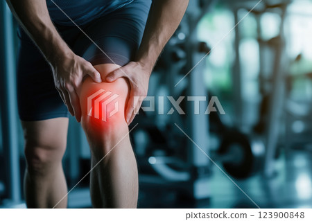 A knee bone is depicted with a bright red area indicating pain. Physical pain and injury in the knee. Generative AI. 123900848