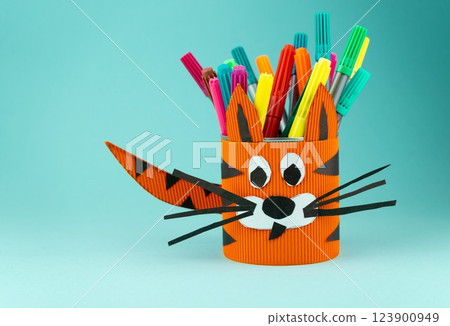 Step 9. Step-by-step instructions on how to make a stand for stationery from a tin can. Tiger made of paper and cardboard, scissors and glue. A fun DIY craft for children. Do it yourself paper tiger Step 9. Step-by-step instructions on how to make a stand for stationery from a tin can. Tiger made of paper and cardboard, scissors and glue. A fun DIY craft for children. Do it yourself paper tiger 123900949