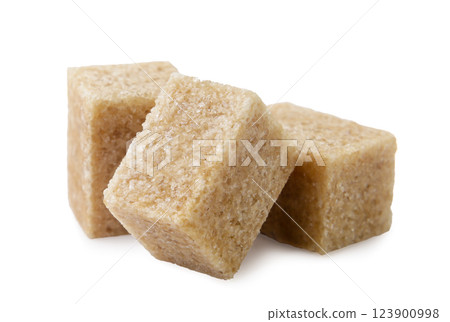 Brown sugar cubes close-up on a white. Isolated Brown sugar cubes close-up on a white. Isolated 123900998