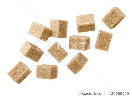 Set of brown sugar cubes flying on a white background. Isolated Set of brown sugar cubes flying on a white background. Isolated 123900999