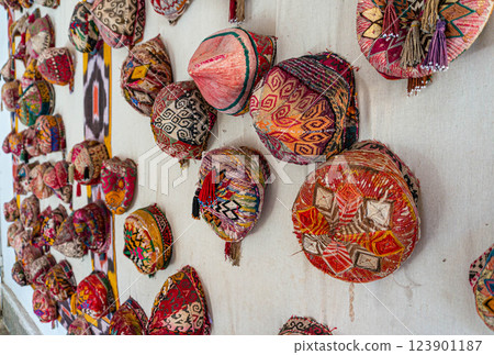 Traditional Uzbek headwear - a skullcap on the wall as decoration. Traditional Uzbek headwear - a skullcap on the wall as decoration. 123901187