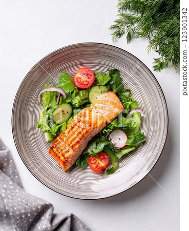 Salmon pepper grilled. Salmon freshly grilled and pepper-crusted Served with panzanella 123901342