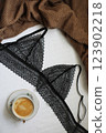 Woman's silk erotic lingerie on the white bed sheets. Valentine's day concept. Lace sexy female underwear. Beauty, fashion blogger concept. Female bra, panties, erotic clothes. Lingerie advertising 123902218