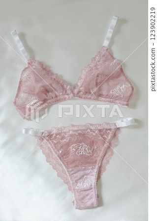 Woman's silk erotic lingerie on the white bed sheets. Valentine's day concept. Lace sexy female underwear. Beauty, fashion blogger concept. Female bra, panties, erotic clothes. Lingerie advertising Woman's silk erotic lingerie on the white bed sheets. Valentine's day concept. Lace sexy female underwear. Beauty, fashion blogger concept. Female bra, panties, erotic clothes. Lingerie advertising 123902219