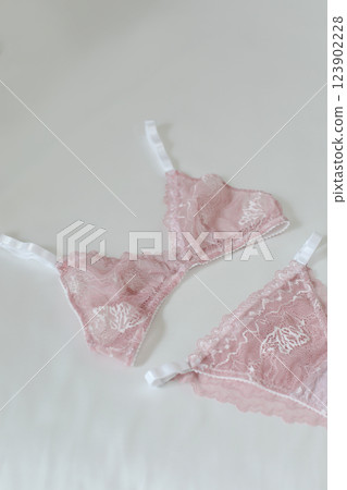 Woman's silk erotic lingerie on the white bed sheets. Valentine's day concept. Lace sexy female underwear. Beauty, fashion blogger concept. Female bra, panties, erotic clothes. Lingerie advertising Woman's silk erotic lingerie on the white bed sheets. Valentine's day concept. Lace sexy female underwear. Beauty, fashion blogger concept. Female bra, panties, erotic clothes. Lingerie advertising 123902228