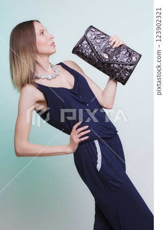 Elegant fashion woman with leather handbag Elegant fashion woman with leather handbag 123902321