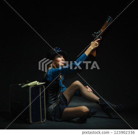 Steampunk girl armed and dangerous. 123902336