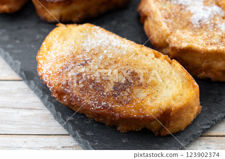 Traditional Spanish torrijas for Holy Week on wooden table. French Toast 123902374