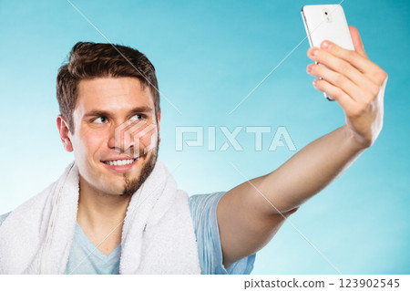Happy half shaved man taking selfie self photo. 123902545