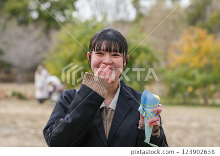 Young woman eating a crepe in the park Young woman eating a crepe in the park 123902638