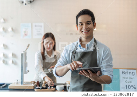 Sustainable Practices and Barista Skills. A barista cheerful while showcasing sustainable practices in the coffee-making process. 123902917