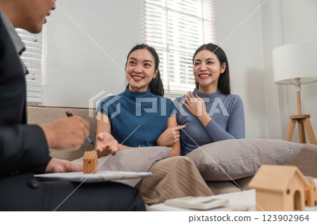 Clients expressing interest in real estate options during consultation 123902964