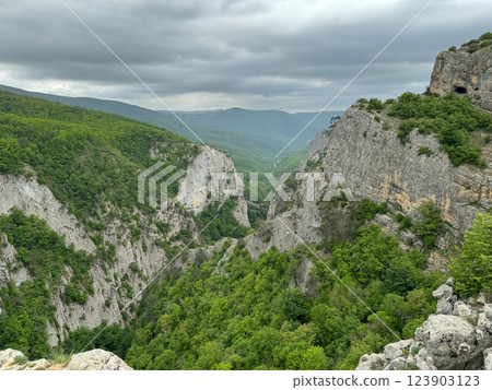 Beautiful mountain scenery and green forest from the top of the cliff Beautiful mountain scenery and green forest from the top of the cliff 123903123