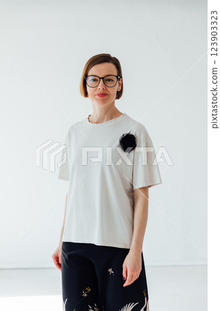 Beautiful woman of 40 years old in a fashionable suit on a white background Beautiful woman of 40 years old in a fashionable suit on a white background 123903323