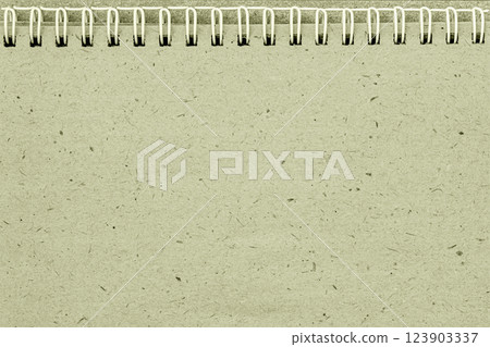 Recycled paper notebook with metal spiral, binding rough texture. Eco-friendly and minimalist organic olive, earthy background for design projects, copy space Recycled paper notebook with metal spiral, binding rough texture. Eco-friendly and minimalist organic olive, earthy background for design projects, copy space 123903337