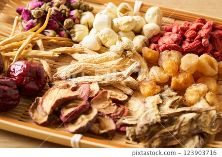 Various herbal medicine ingredients served in a colander 123903716