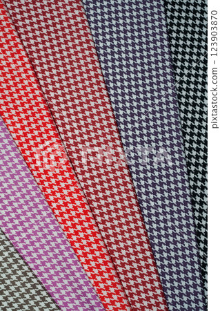 Multi-colored fabric patterns with geometric pattern for sewing. 123903870