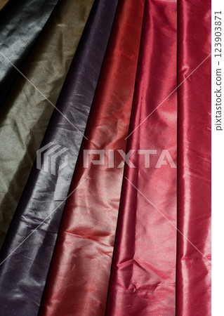 Multi-colored fabrics with a smooth texture and rich shades. 123903871