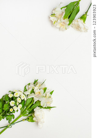 Styled stock photo. Feminine wedding desktop mockup with baby's breath Gypsophila flowers, dry green eucalyptus leaves, satin ribbon and white background. Empty space. Top view. Picture for blog 123903923