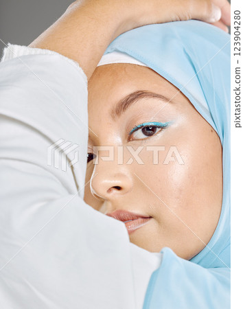 Muslim, woman face and beauty, makeup and hijab with Islamic fashion, natural cosmetics advertising with studio background. Beautiful, young and traditional head scarf, glow in closeup portrait. Muslim, woman face and beauty, makeup and hijab with Islamic fashion, natural cosmetics advertising with studio background. Beautiful, young and traditional head scarf, glow in closeup portrait. 123904280